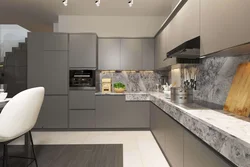 Kitchen With A Gray Countertop In A White Interior And An Apron