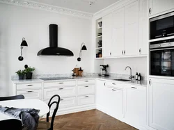 White kitchen design with black handles