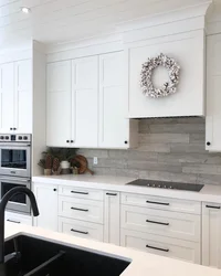 White kitchen design with black handles