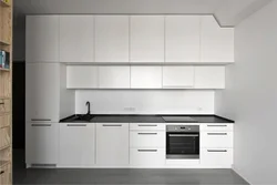 White kitchen design with black handles