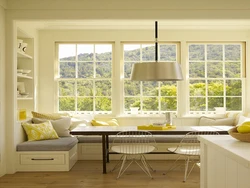 Kitchen living room interior with sofa by the window