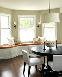 Kitchen living room interior with sofa by the window