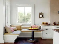 Kitchen Living Room Interior With Sofa By The Window