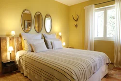 Yellow wall color in the bedroom interior