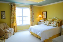 Yellow wall color in the bedroom interior