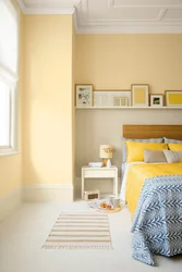 Yellow wall color in the bedroom interior