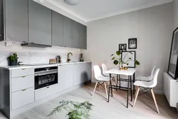 Gray walls white kitchen photo