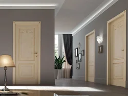 White doors and baseboards in the apartment interior photo