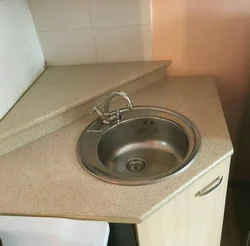 Corner kitchen sink with cabinet photo