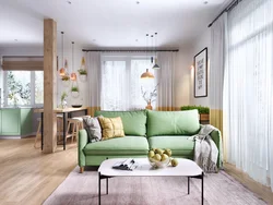 Green sofa in the interior of the kitchen living room