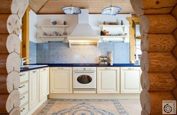 Photo of a kitchen made of rounded logs