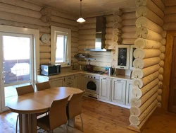 Photo of a kitchen made of rounded logs