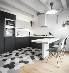 Gray floor and gray walls in the kitchen interior photo