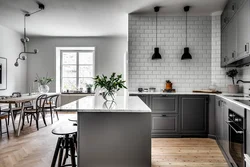 Gray floor and gray walls in the kitchen interior photo