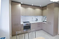 Matte beige kitchen in the interior photo