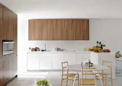 Combined white kitchen with wood photo