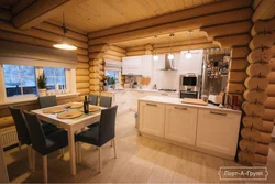 Kitchen design for home made of rounded logs