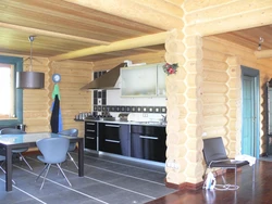 Kitchen design for home made of rounded logs