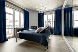 Blue wallpaper in the bedroom interior curtains