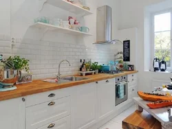 Kitchen With Wooden Countertop And Wood-Effect Apron Design Photo