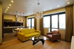 Yellow sofa in the interior of the kitchen living room