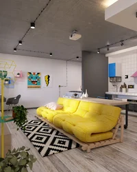 Yellow sofa in the interior of the kitchen living room