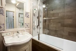 Design of a bathroom with a bathtub in a panel house apartment