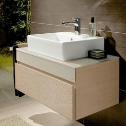 Bathtub with wall-hung sink photo