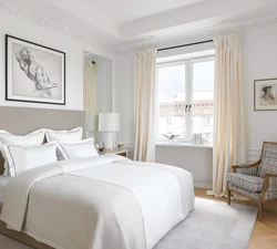 White curtains in the bedroom interior