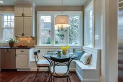 Kitchen design with corner sofa and window