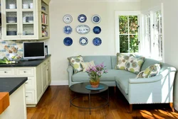 Kitchen design with corner sofa and window