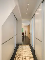Wardrobe in a long narrow corridor in an apartment photo