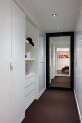 Wardrobe In A Long Narrow Corridor In An Apartment Photo