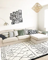 Carpet with a corner sofa in the living room interior photo