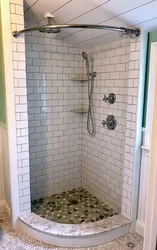 Photo of a bathroom with a tray instead of a bathtub