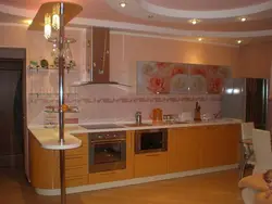 Peach-colored kitchen in the interior photo