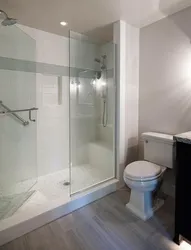 White bathrooms with showers photo