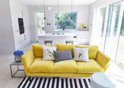 Yellow sofa in the kitchen in the interior photo