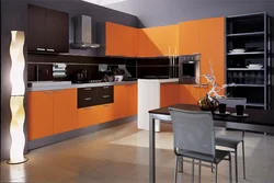 Orange-black kitchen in the interior photo