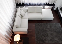 Corner sofa with sleeping place in the interior
