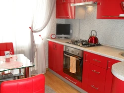 Red interior of a small kitchen