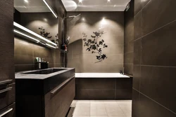 Photo of a bathroom with dark tiles