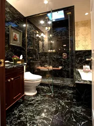 Photo of a bathroom with dark tiles