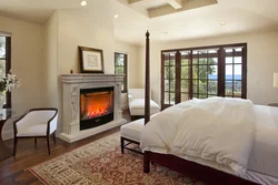 Electric fireplace in the bedroom interior photo