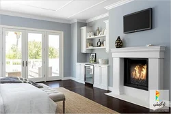 Electric fireplace in the bedroom interior photo
