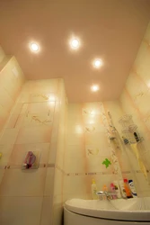 Light bulbs in the suspended ceiling in the bathroom photo