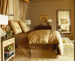 Gold color in the bedroom interior