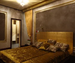 Gold color in the bedroom interior