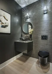 Bathroom design with black toilet and sink