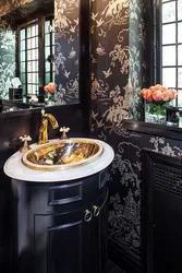 Bathroom design with black toilet and sink